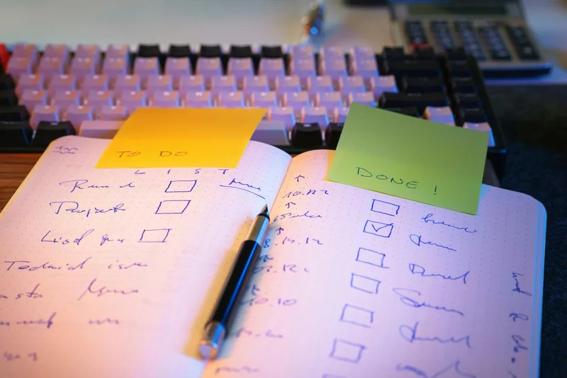 A solopreneur reviewing validation notes and documentation before making a go or no-go decision